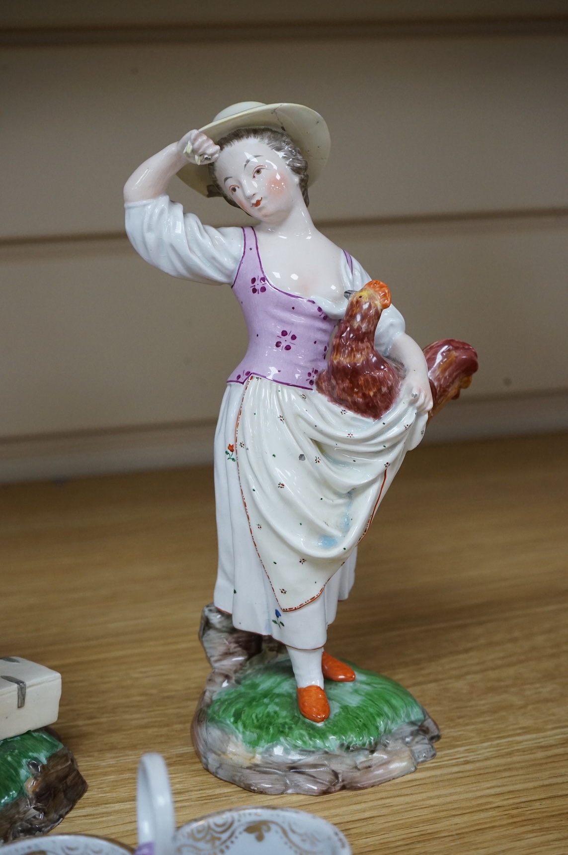 A pair of 19th century Hochst Damm faience figures and a Meissen twin section salt, tallest figure 20cm
